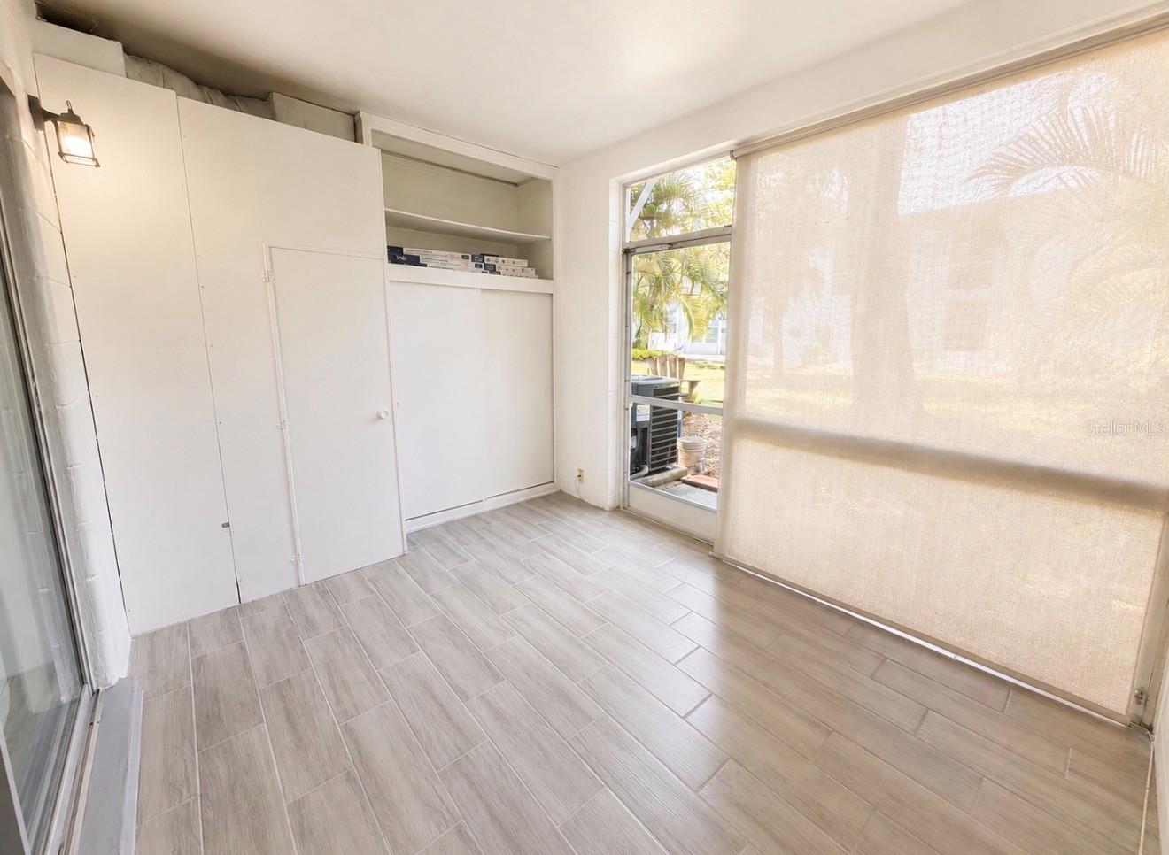screened back porch with storage
