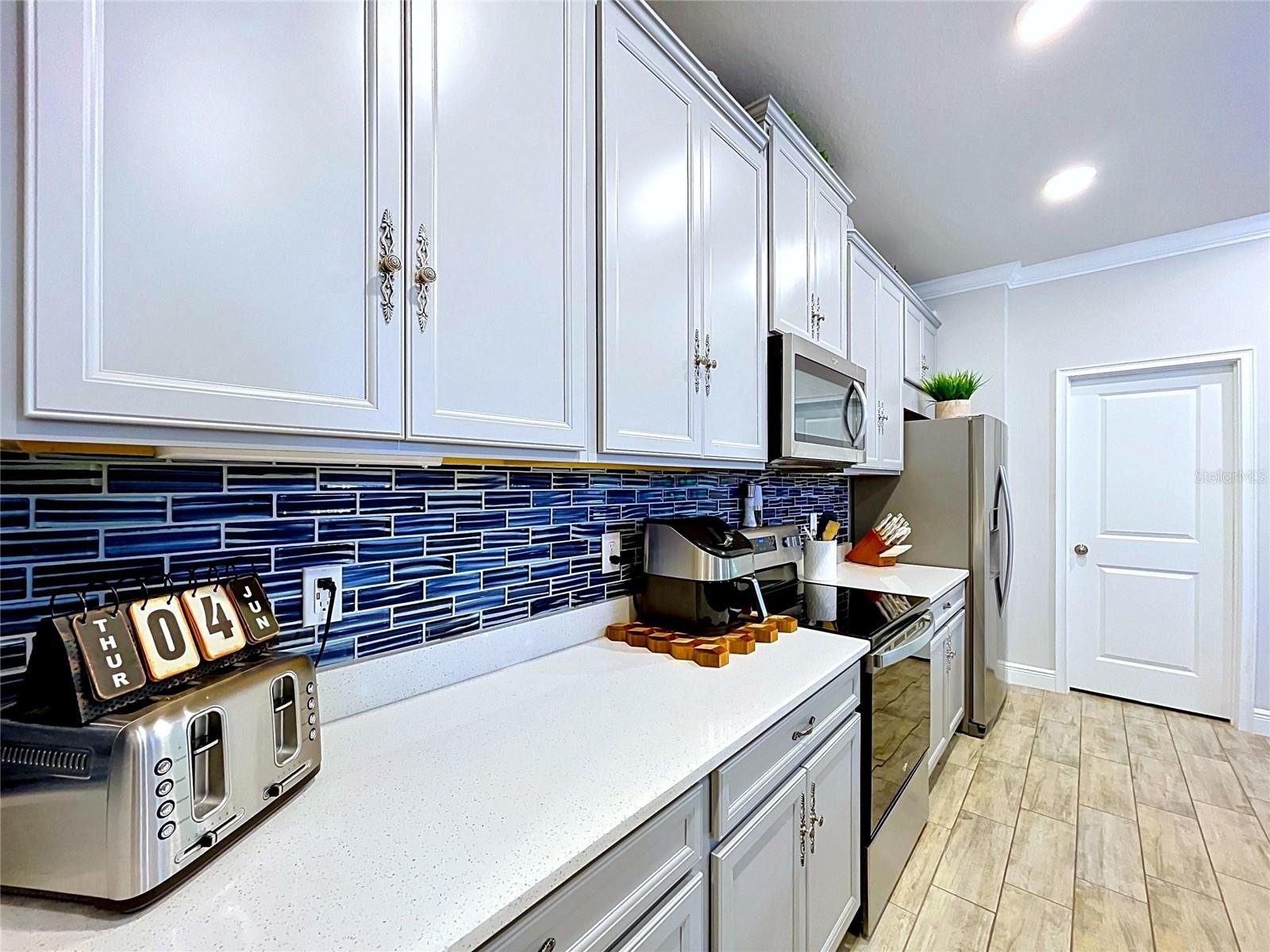 Home chefs will appreciate the generous counter space, abundant storage, and efficient layout designed to make meal preparation effortless while keeping everything within reach.