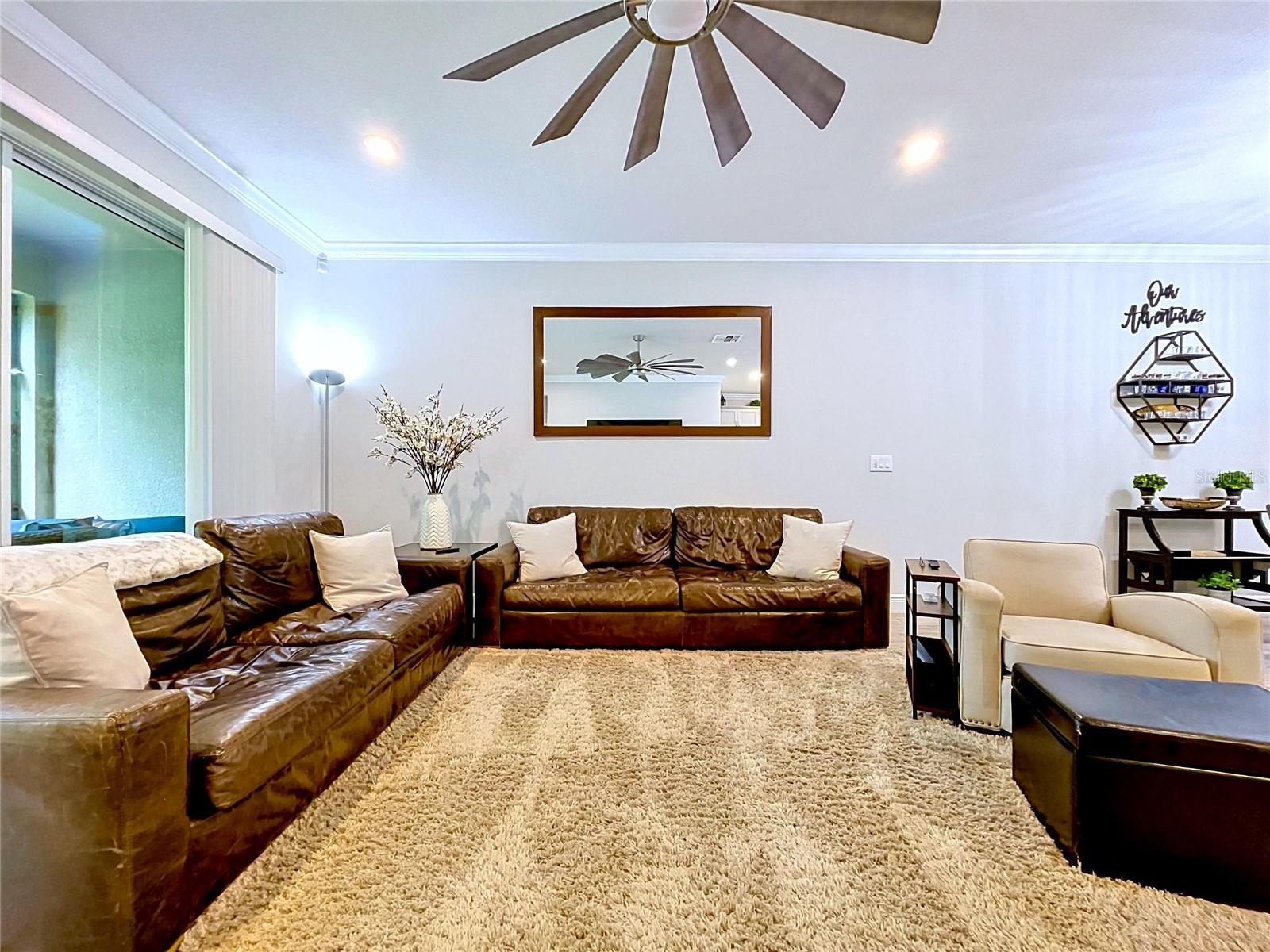 Designed for relaxation, this inviting living area easily accommodates family and guests while maintaining an airy, open feel that makes the home live larger than its footprint.