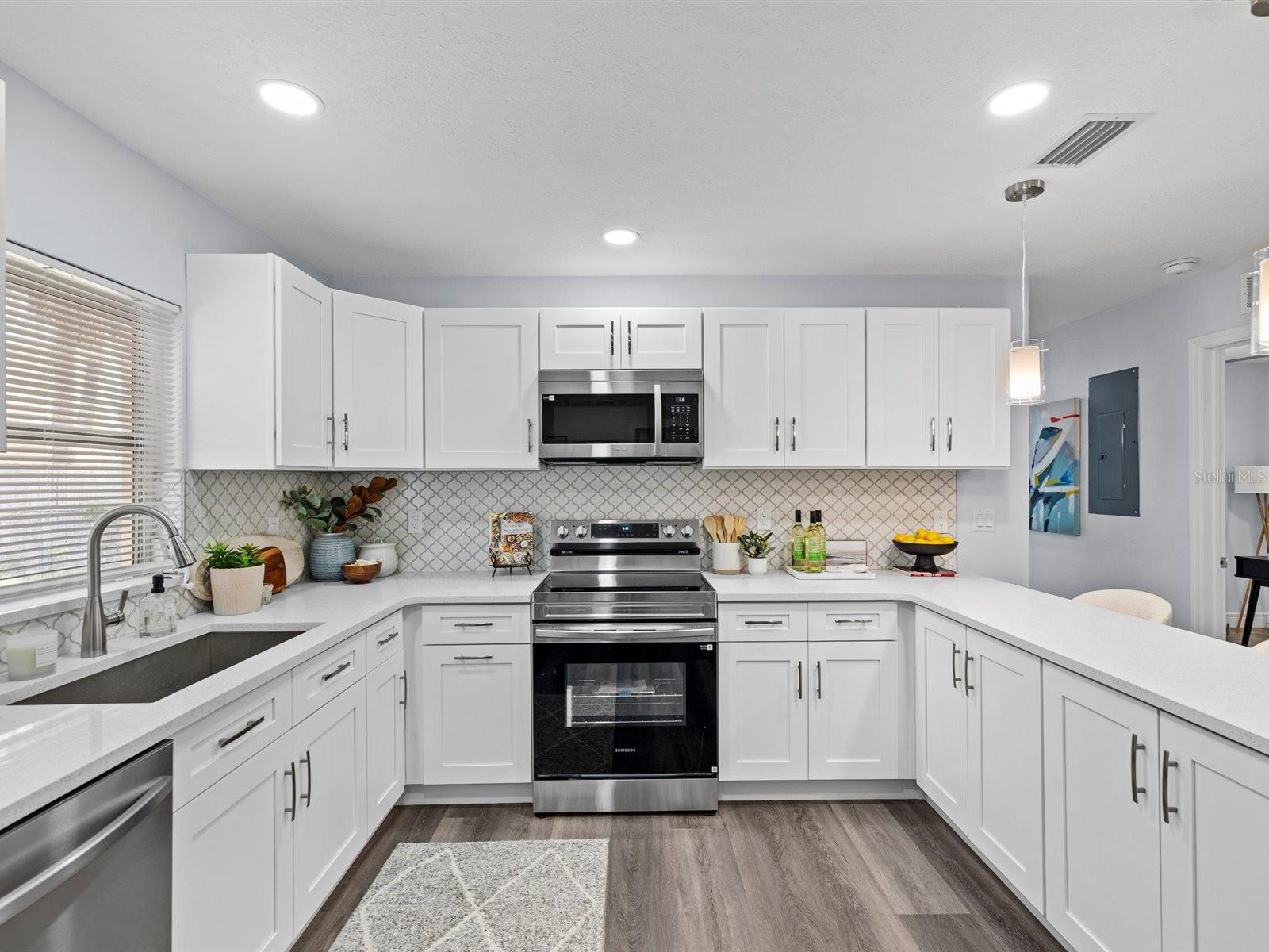 Beautifully appointed kitchen with stainless appliances