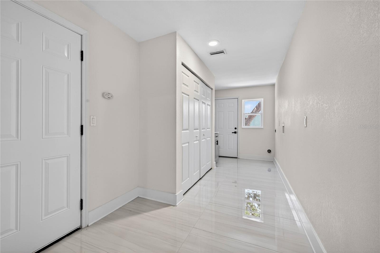 Laundry Room w/ Garage access and door to side yard