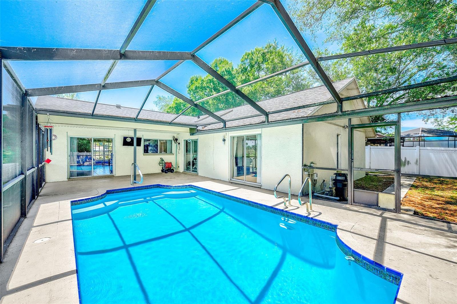 View of inground pool and deck