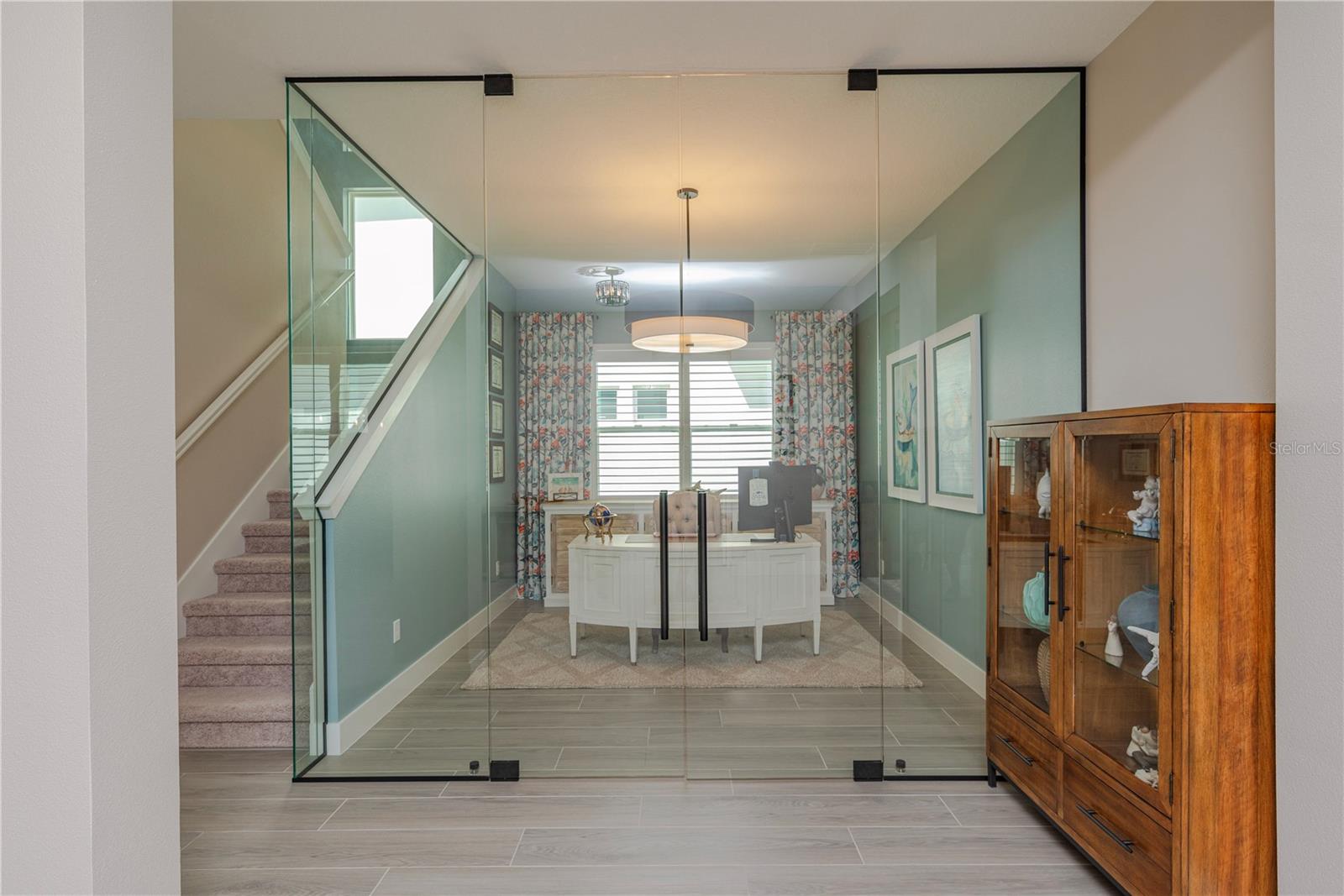 Glass-walled executive office.