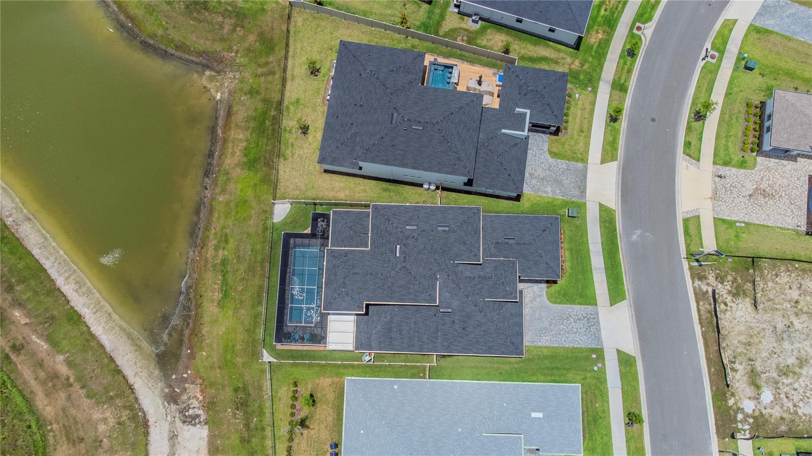 Aerial view of the home and water view.