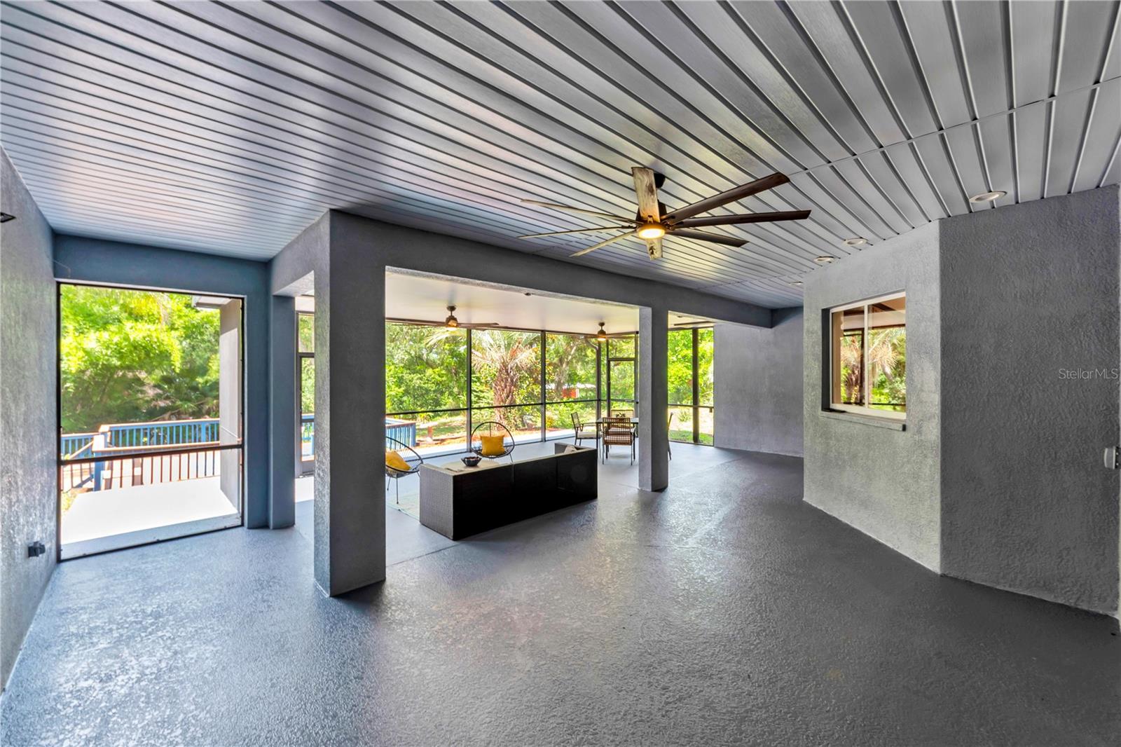 Screened in porch with pass through window to kitchen