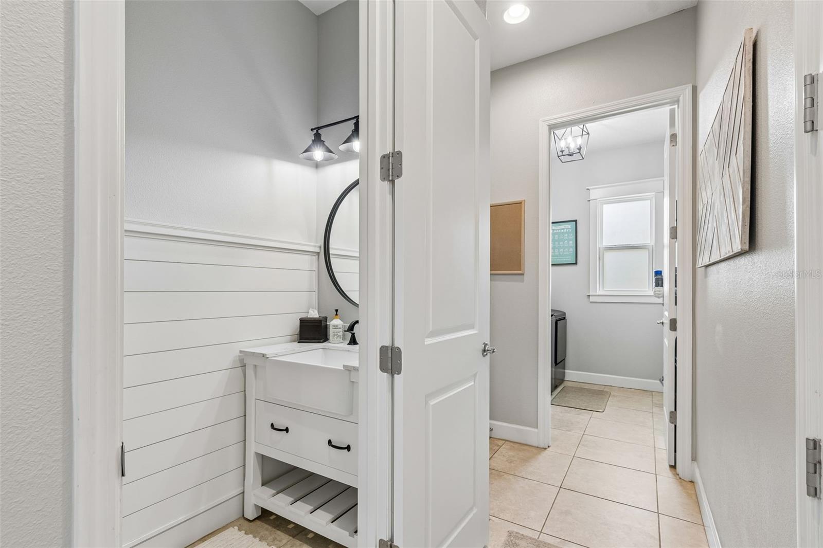 Hall 1/2 Bath with Laundry room in the distance