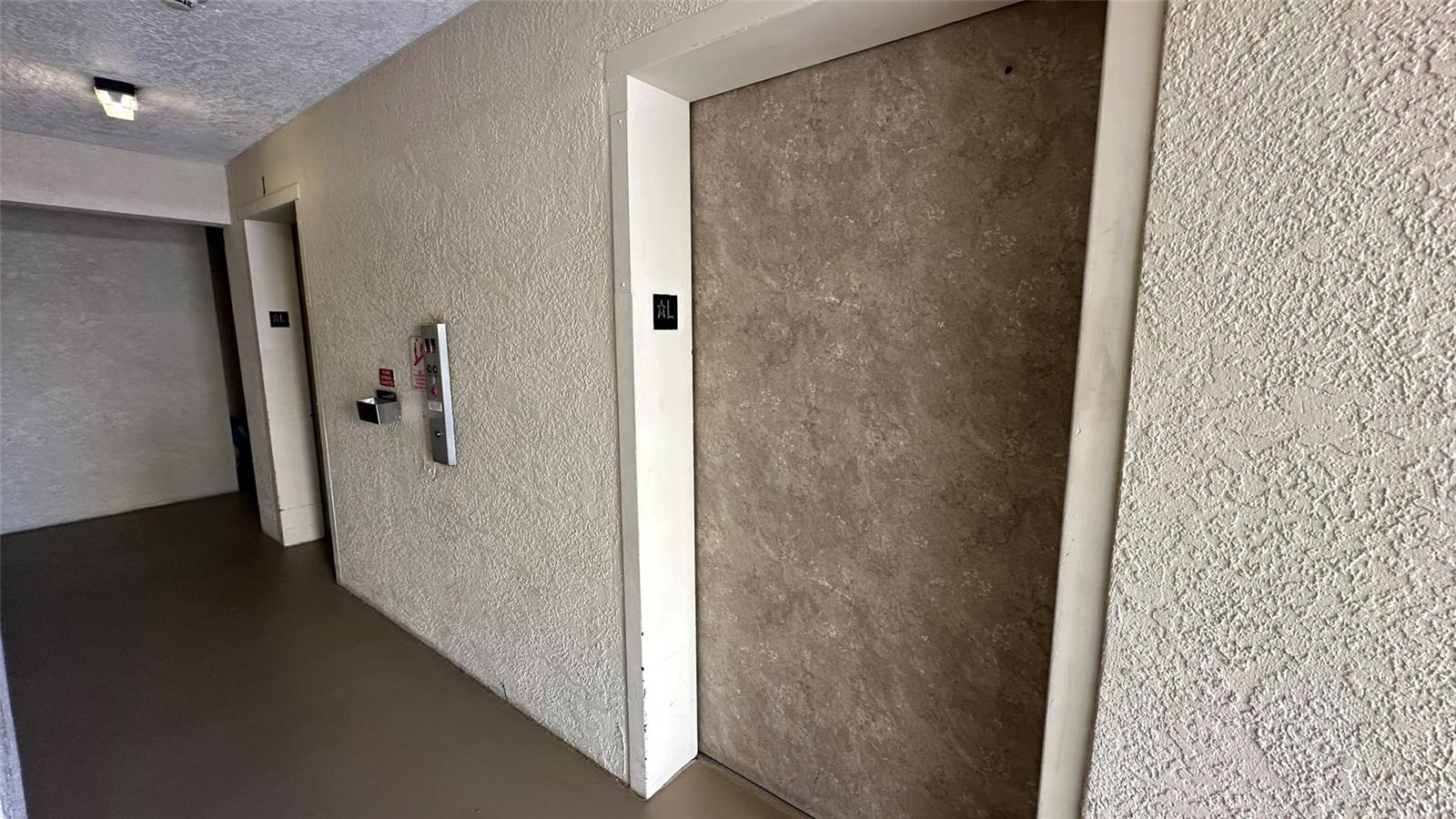 Two Elevators at Building 3400, and Two Staircases. Maiboxes and Community Boards on Floor 1
