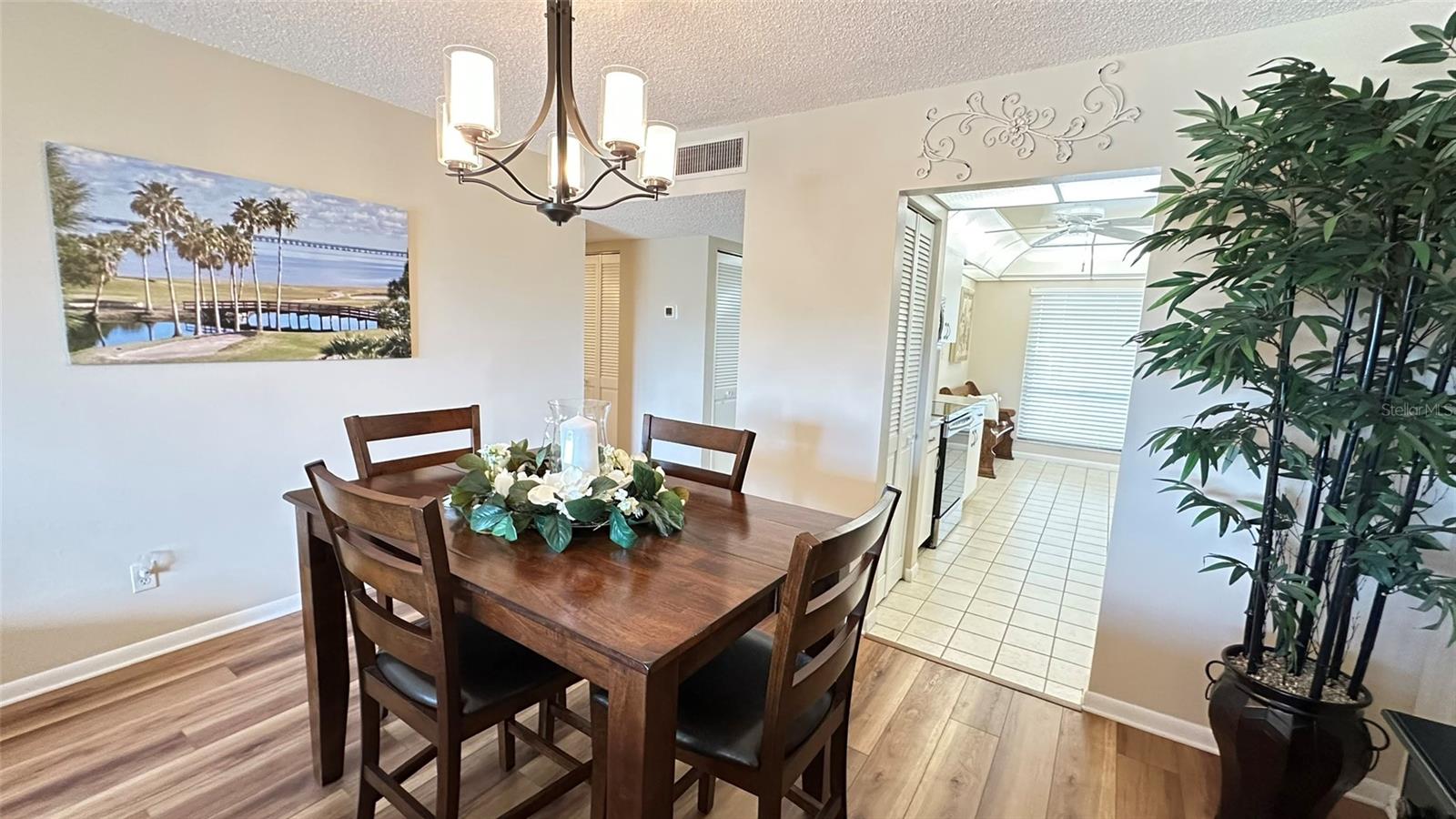 Dining in Great Room. Kitchen Beyond