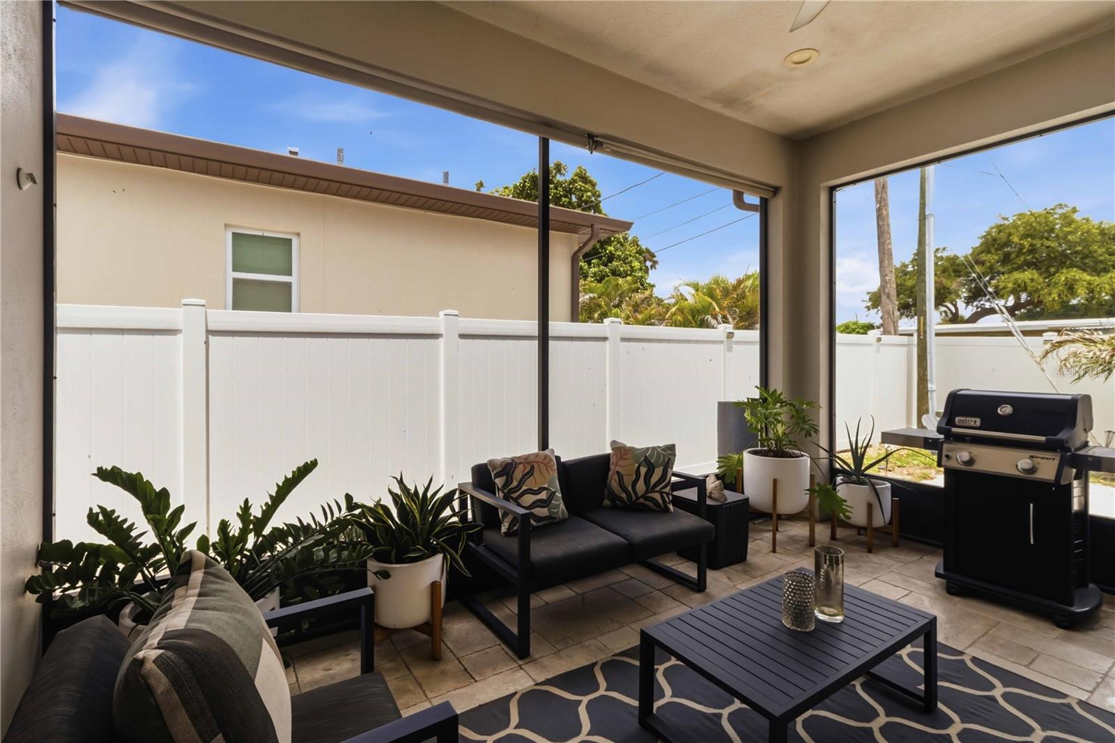 A breezy screened lanai made for relaxed Florida living