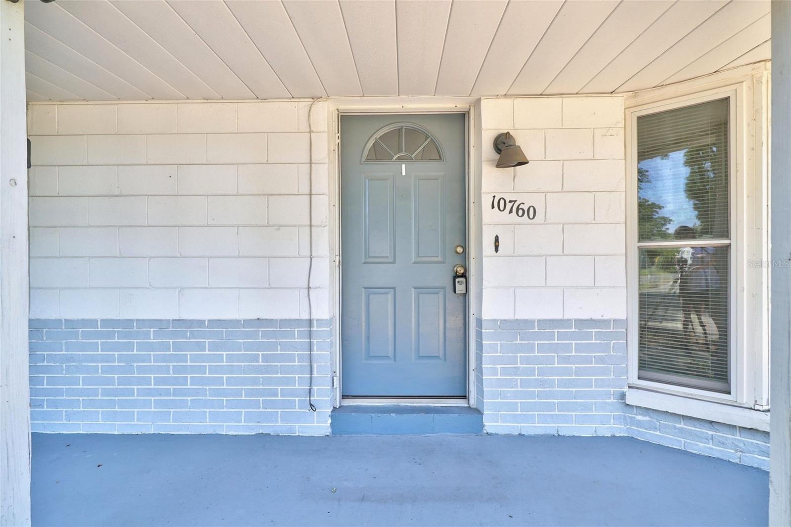 Welcome to your new home with a shaded entrance