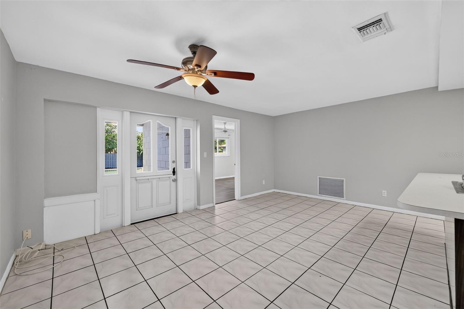 Back door access to the pool off the Kitchen-family room .