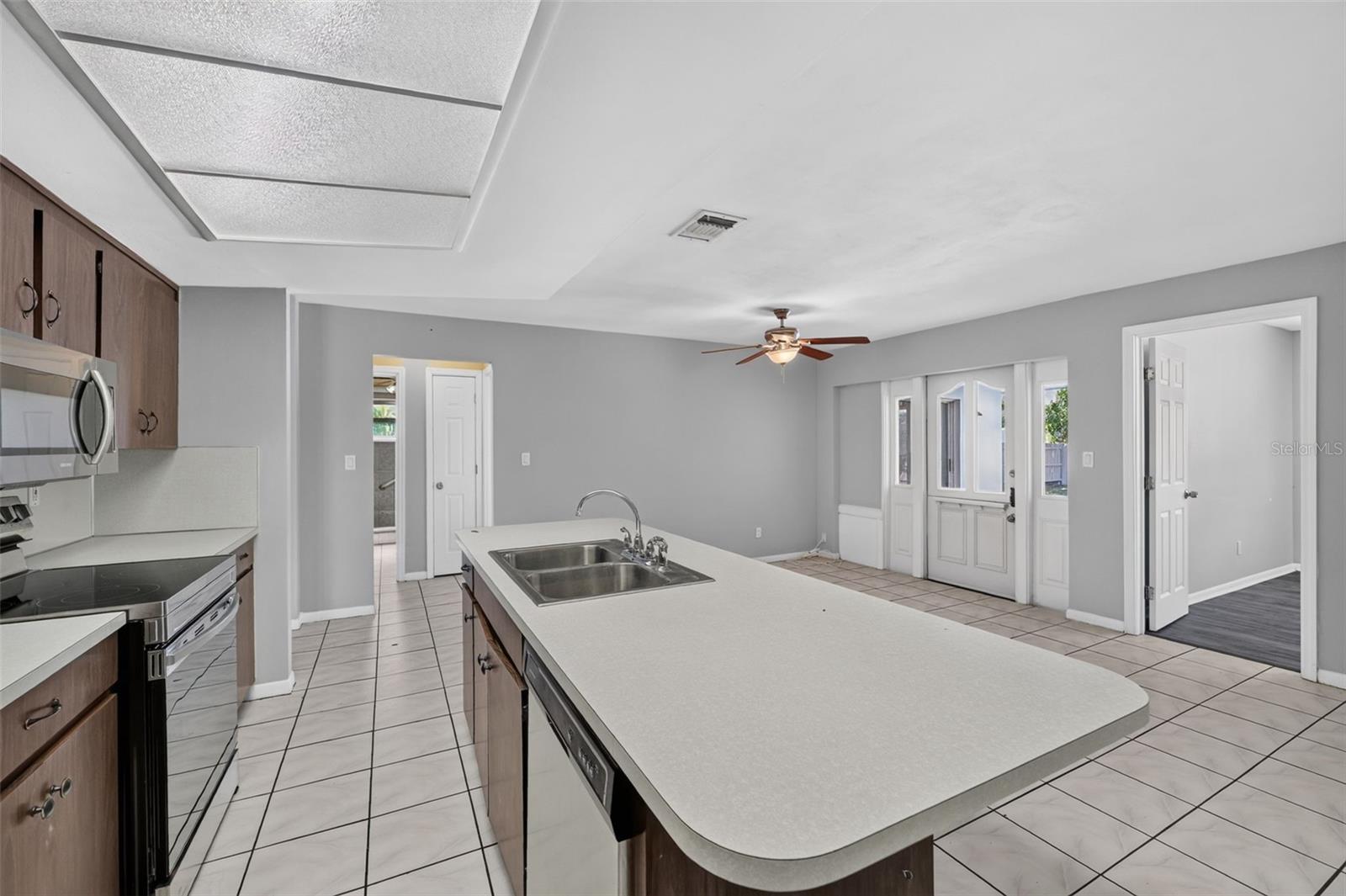 Large Kitchen family room combo  central to the surrounding 3 bedrooms.