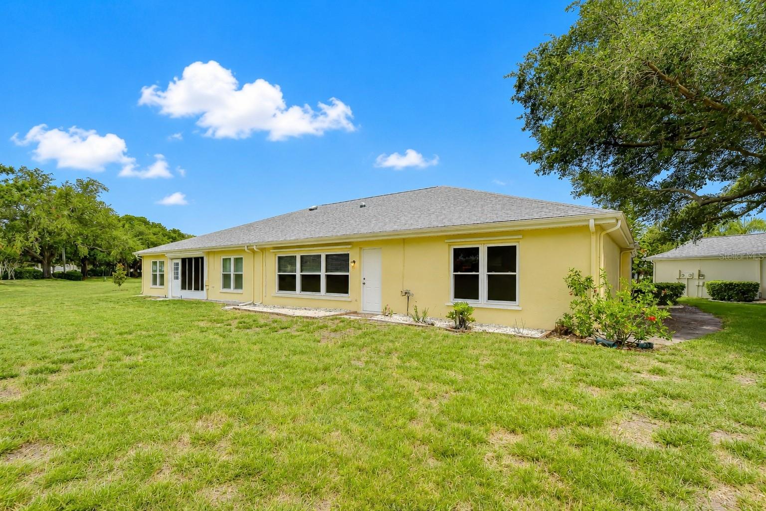 Charming curb appeal with mature landscaping and inviting design.