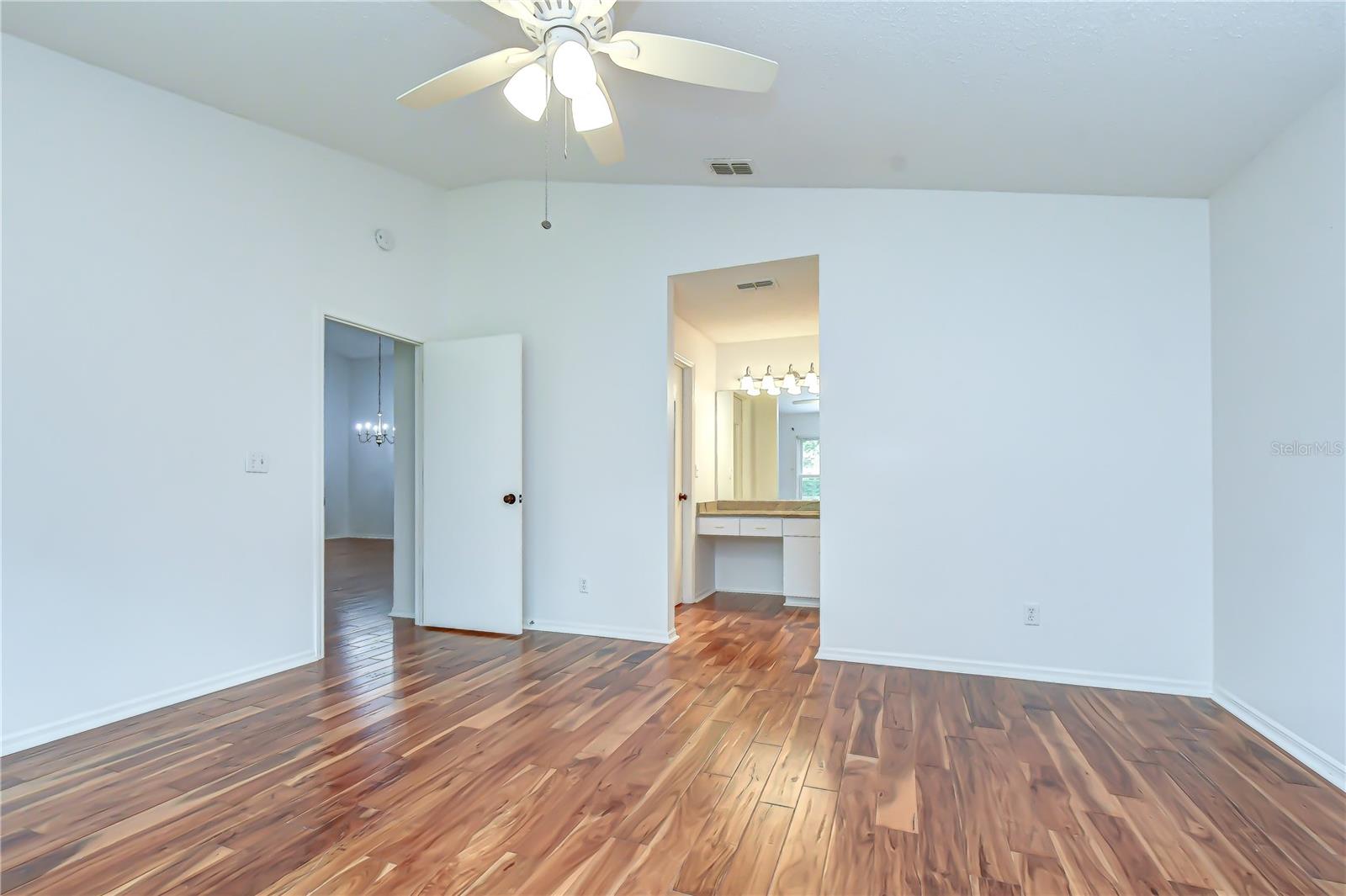 Beautiful hardwood flooring throughout living areas and bedrooms.