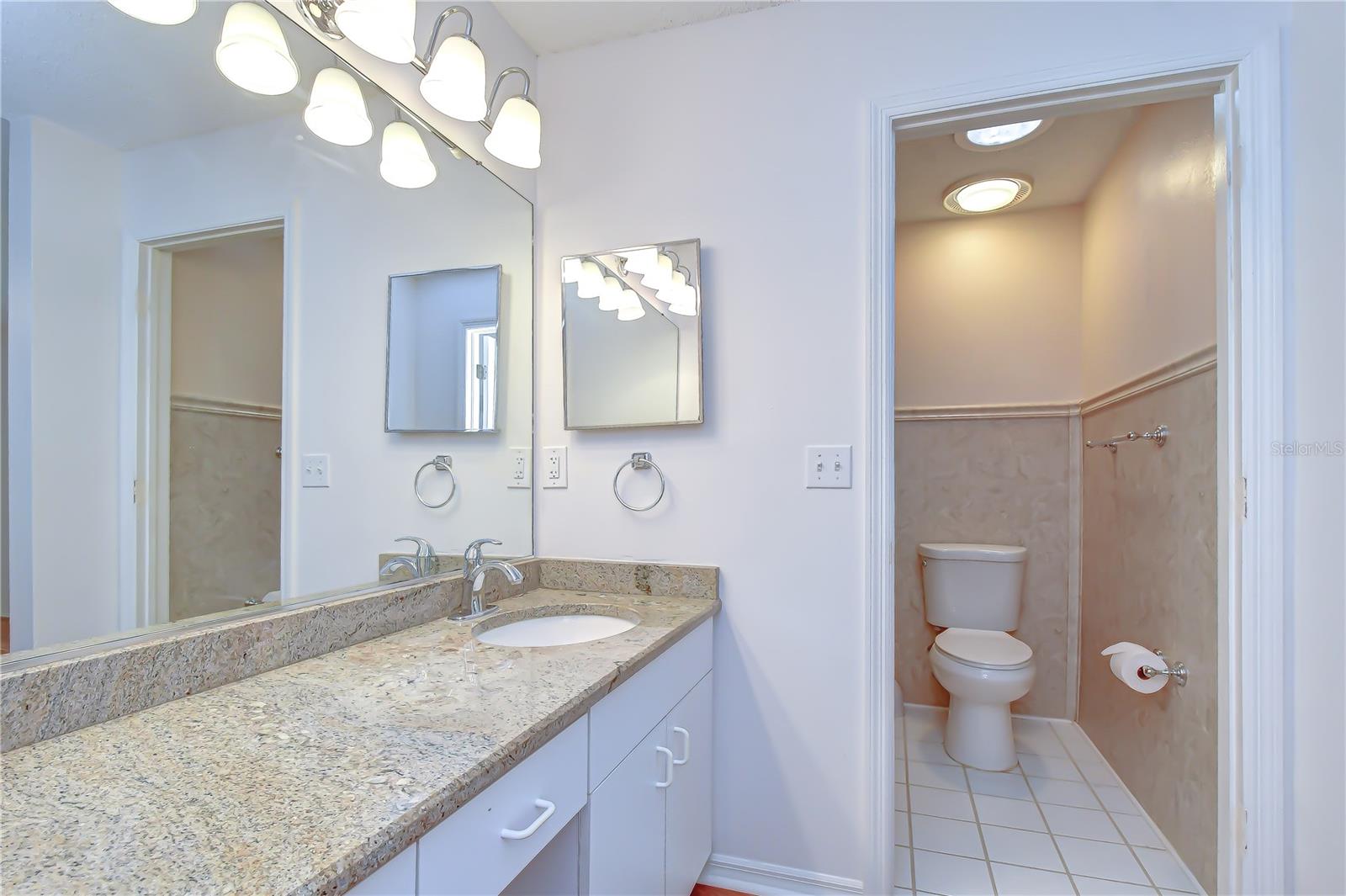 Updated en-suite bath with modern finishes.