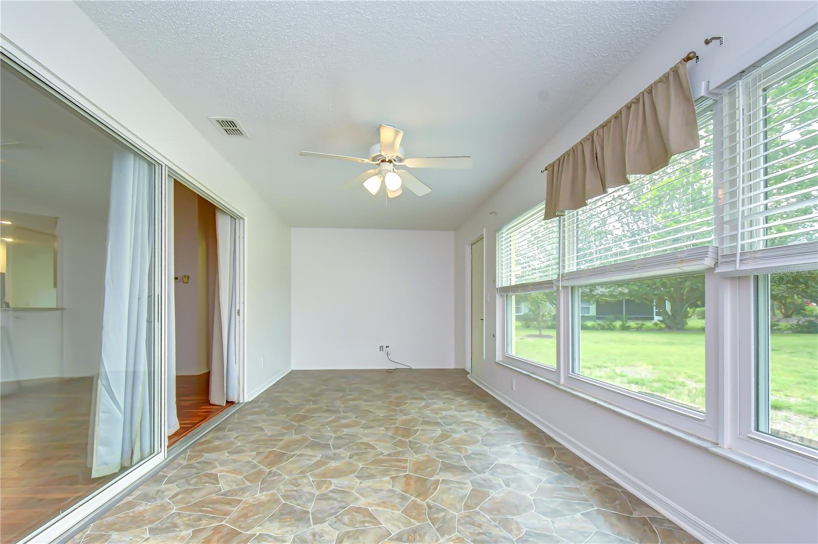 Air-conditioned Florida Room providing valuable year-round living space.