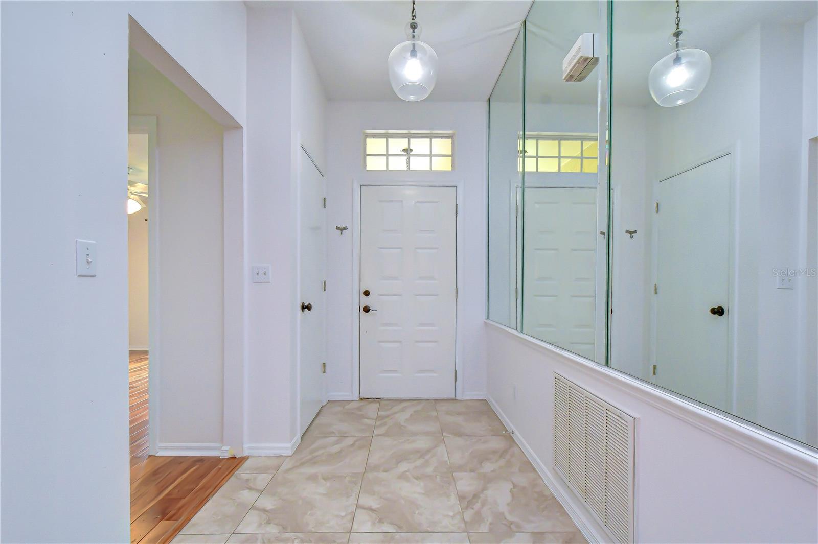 Welcoming entrance leading into bright, open living spaces.