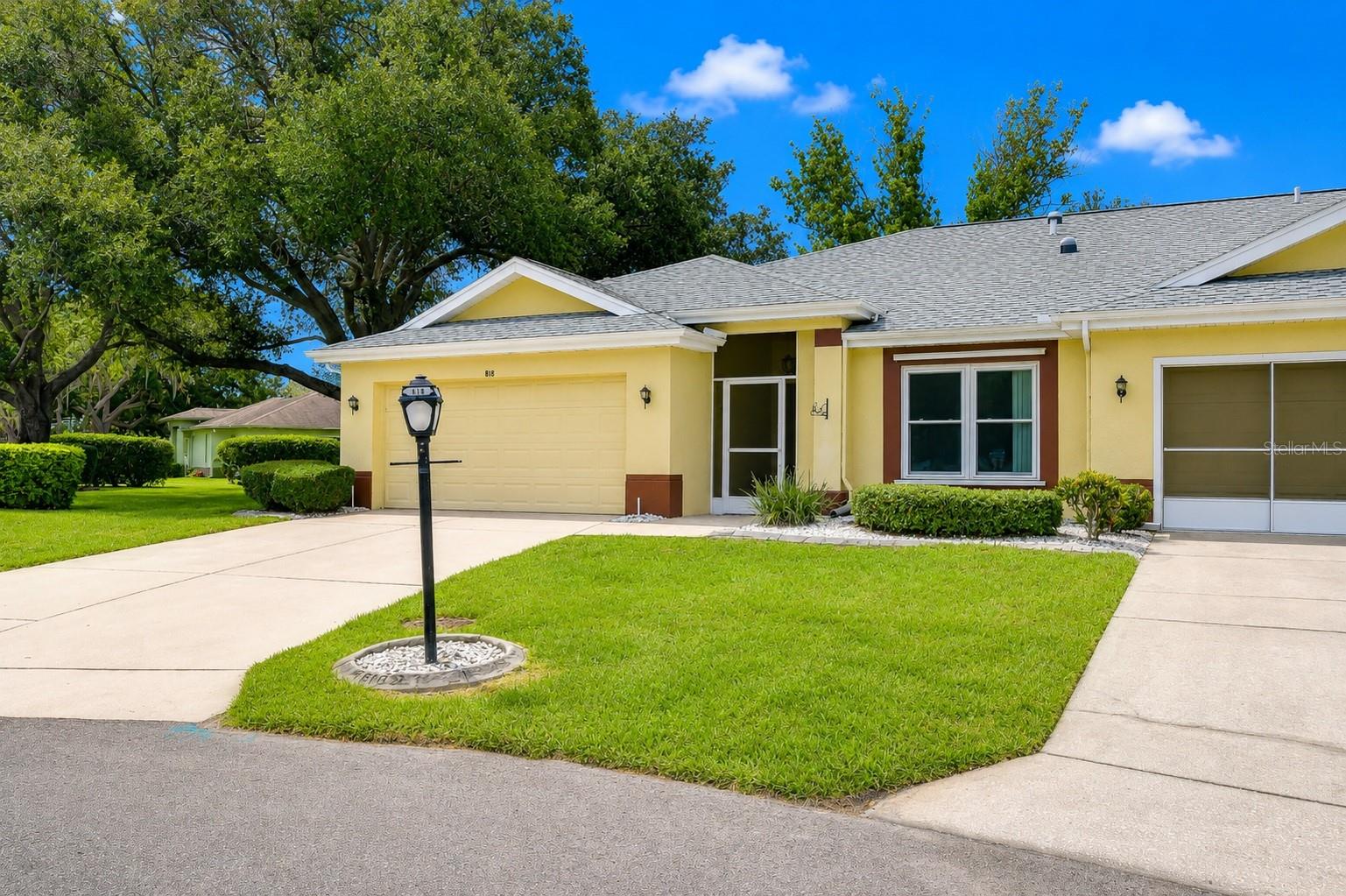 Spacious driveway leading to attached garage.