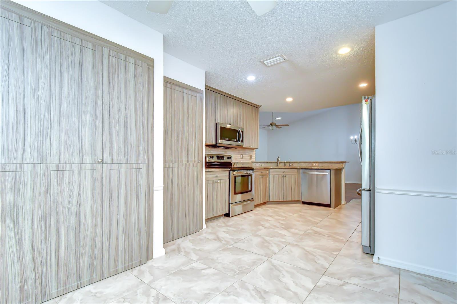 Abundant upper cabinetry maximizing storage space.