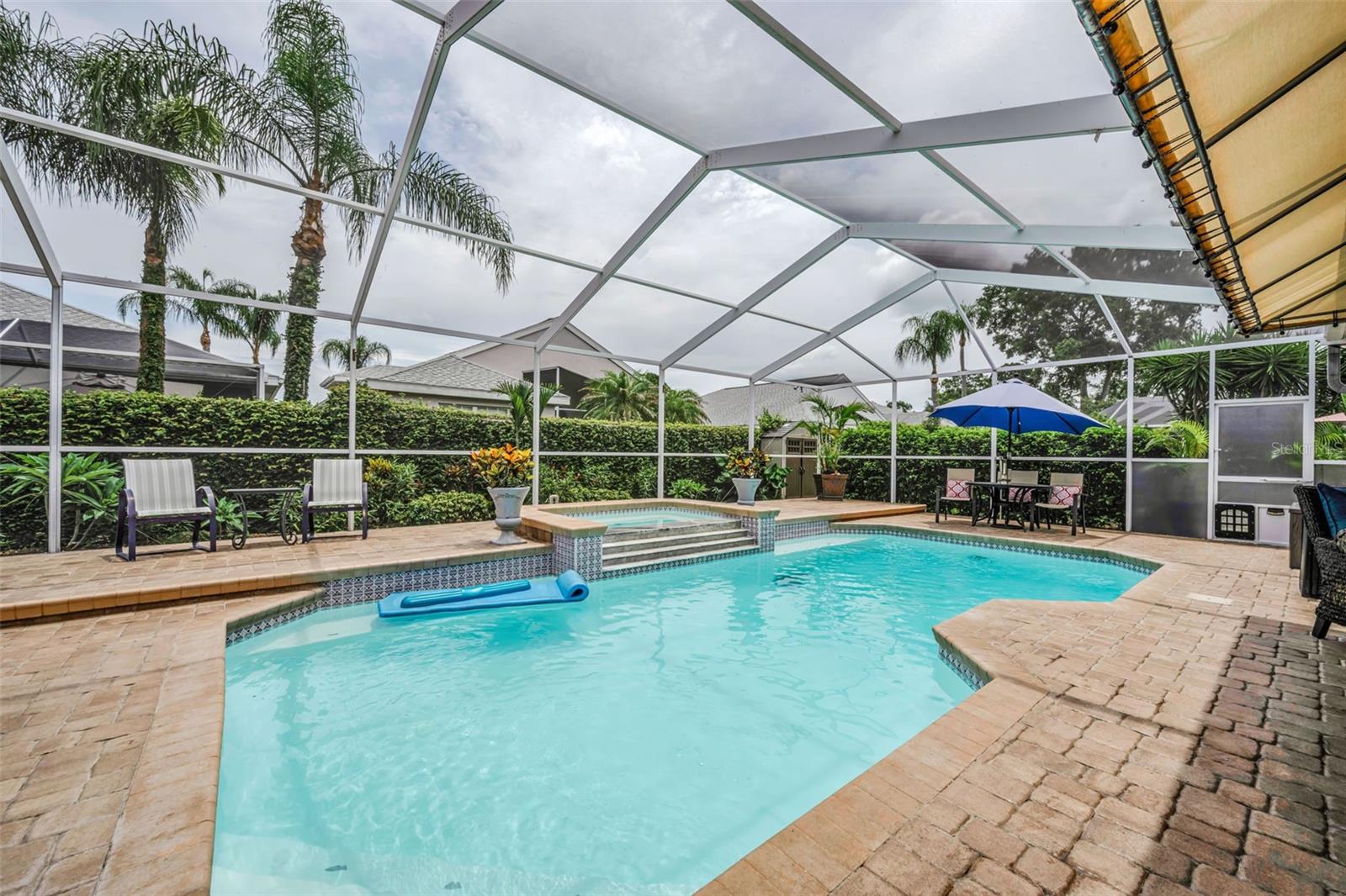 Heated Screen exclosed pool with overflow spa