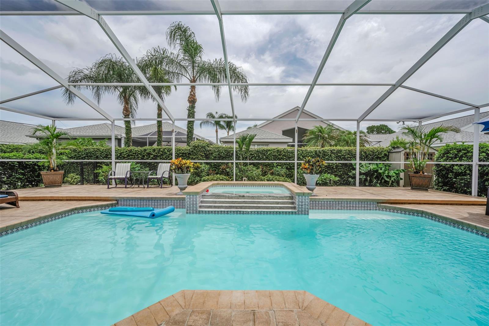 Overflow spa, heated pool and screened lanai