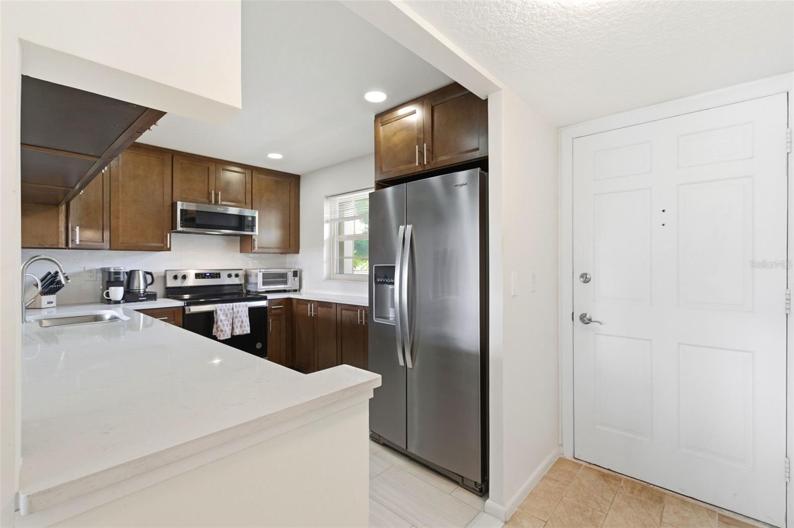Kitchen is to your right upon entering the home.