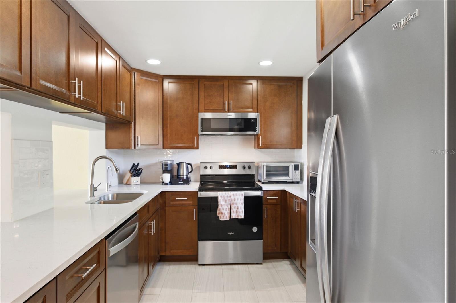 Fully updated Kitchen! Newer tile floors, recessed lighting, cabinets, granite counter tops, stainless steel appliances, and a reverse osmosis system under the kitchen sink.