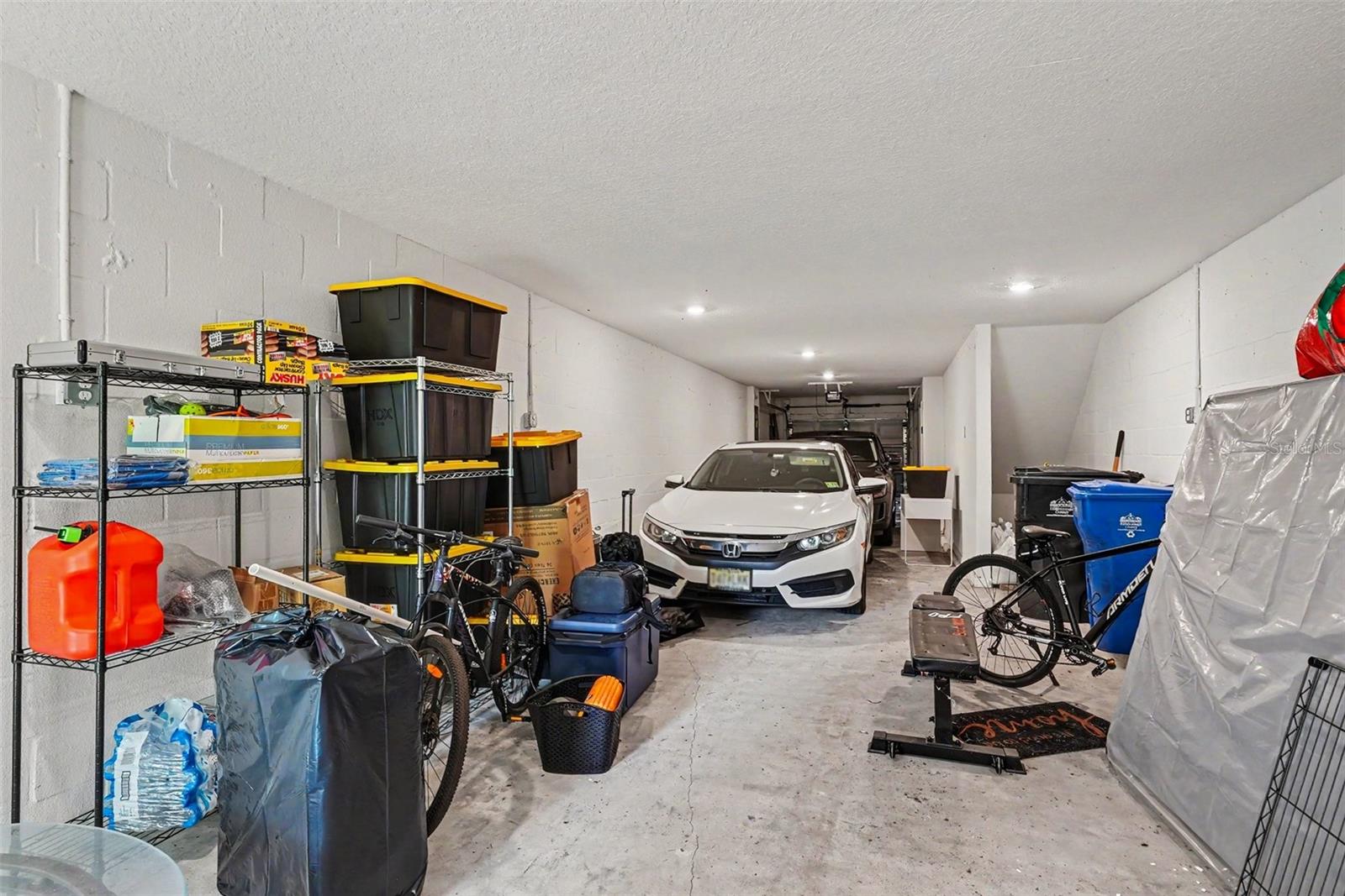 Two car garage, plus storage space. Back door in garage to the back exterior.