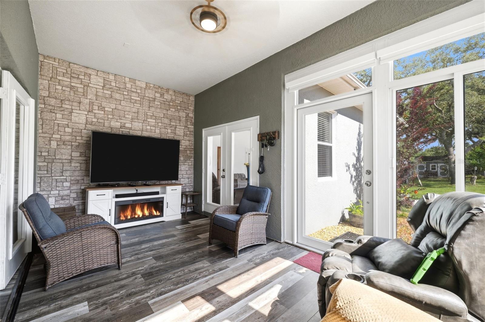 sunroom with electric fireplace