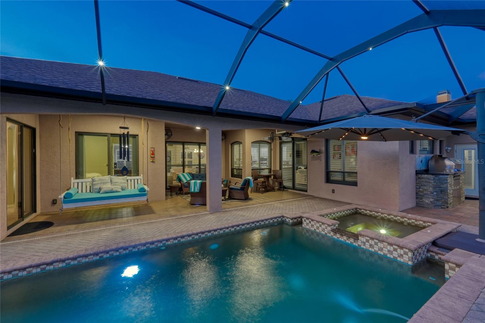 Imagine relaxing on a starry night in the screened in pool cage