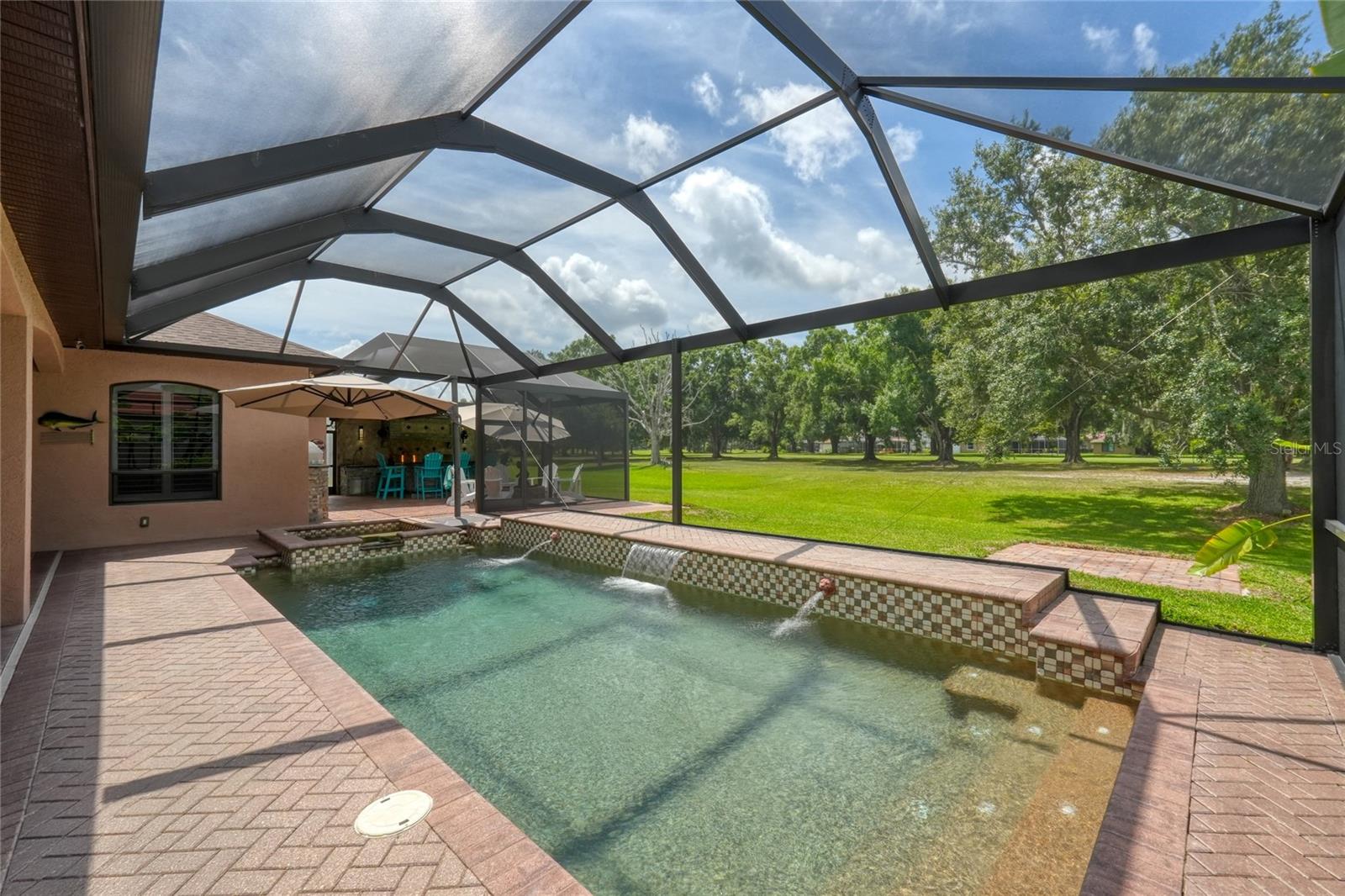 Enjoy the Florida sunshine in this heated pool