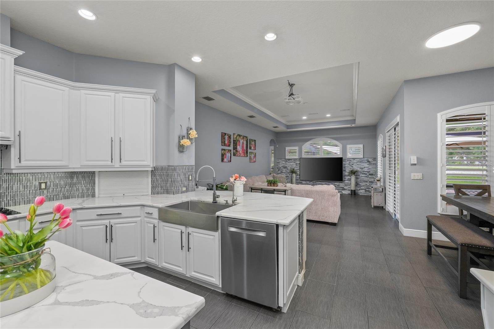 This Kitchen has quartz countertops and tons of storage