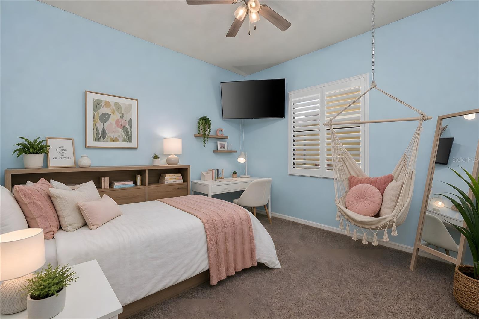 Bedroom 2 with ceiling fan and plantation shutters