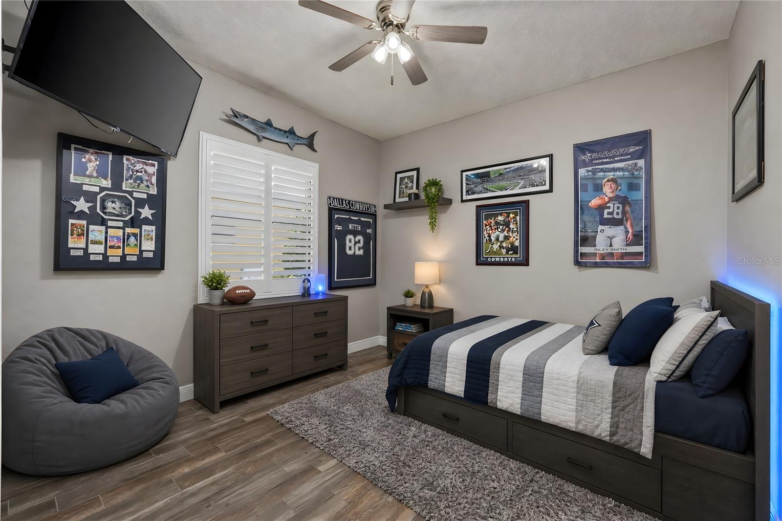 Bedroom 3 with ceiling fan and plantation shutters