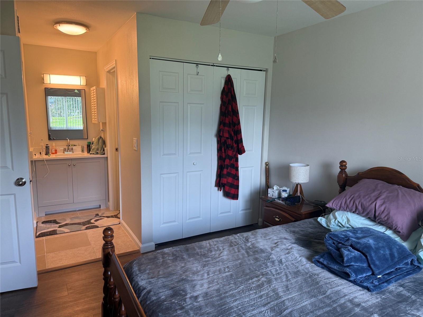 PRIMARY BEDROOM W/VIEW TO PRIMARY BATHROOM