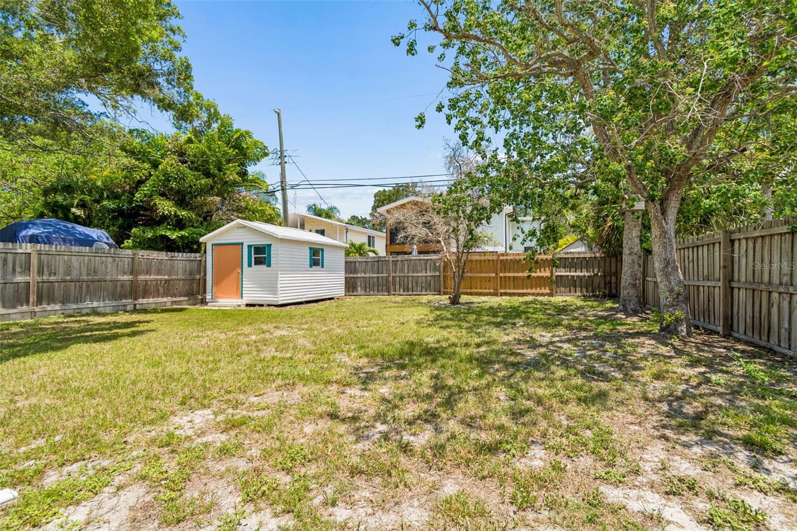 Spacious  back yard with alley access, if you choose to use alley.