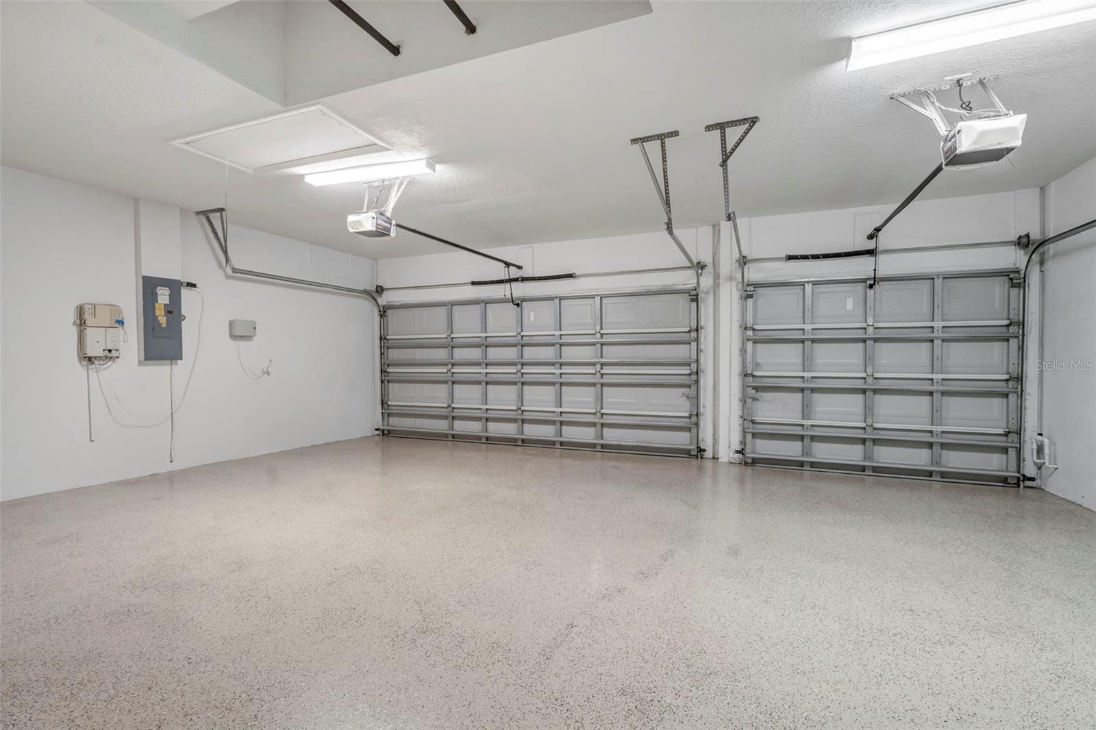 Large 3 car garage with fresh epoxy floors