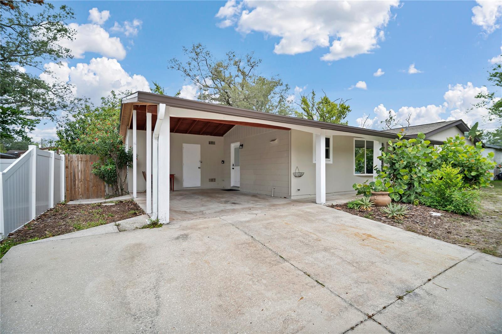 Spacious Carport with Storage and Laundry Room
