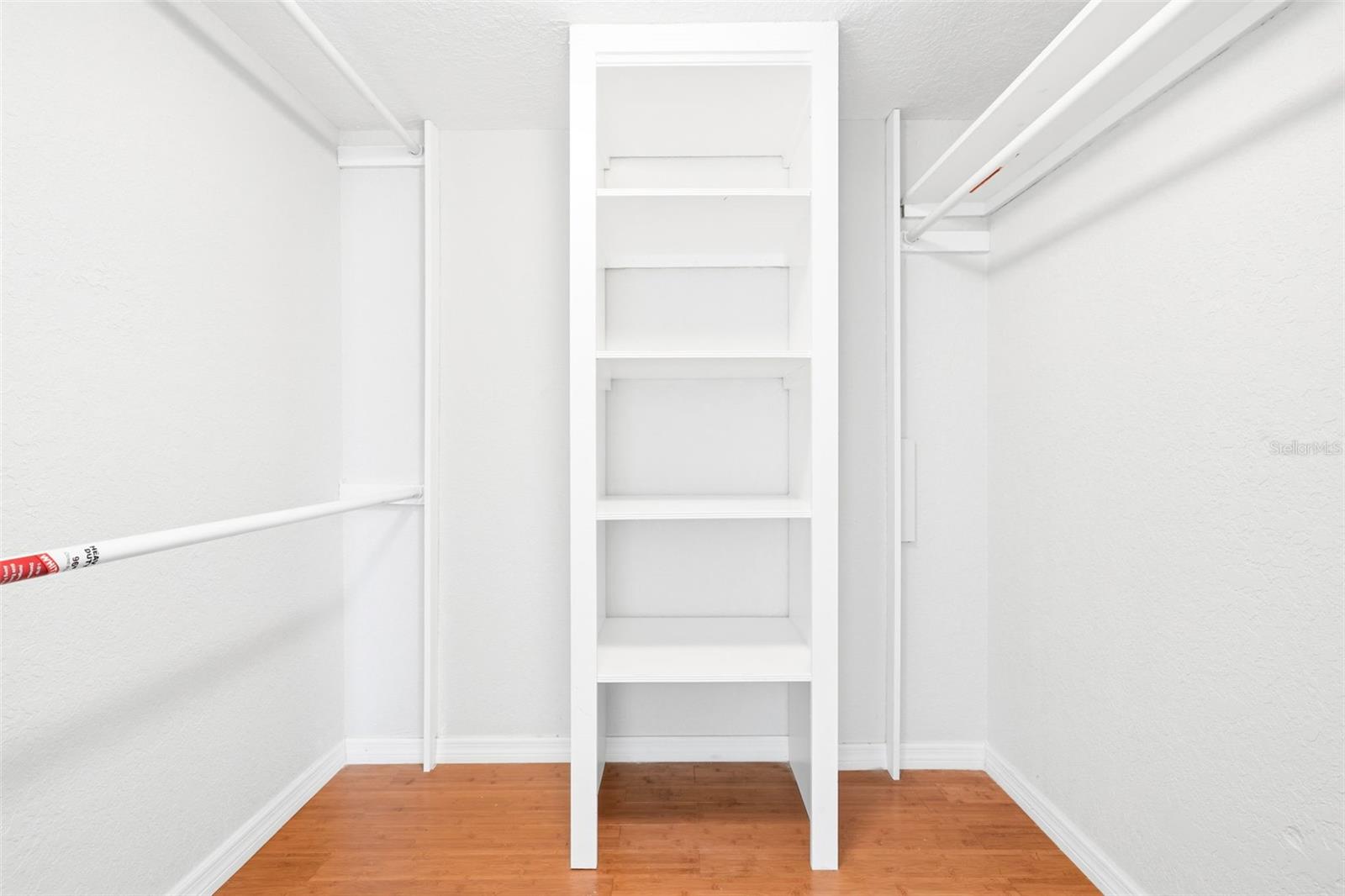 Walk in closet primary bedroom