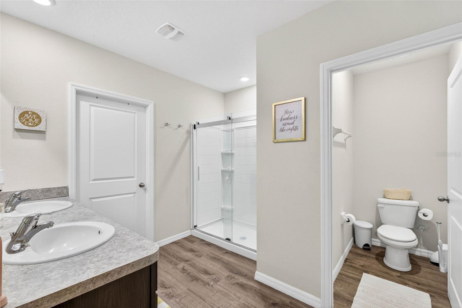 Primary Bath with Dual Sinks and Closets