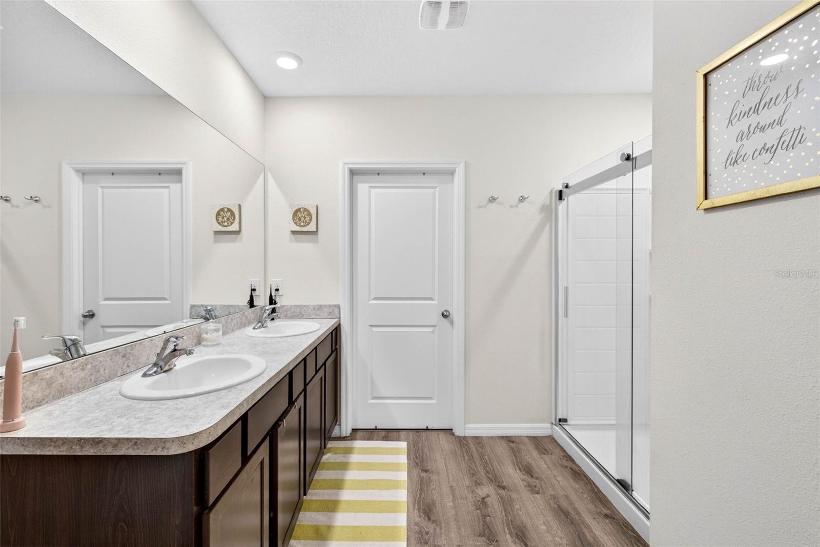 Primary Bath with Dual Sinks and Closets