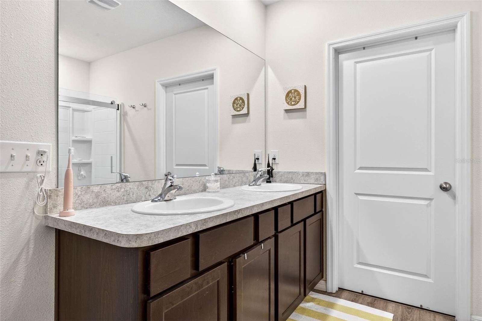 Primary Bath with Dual Sinks and Closets