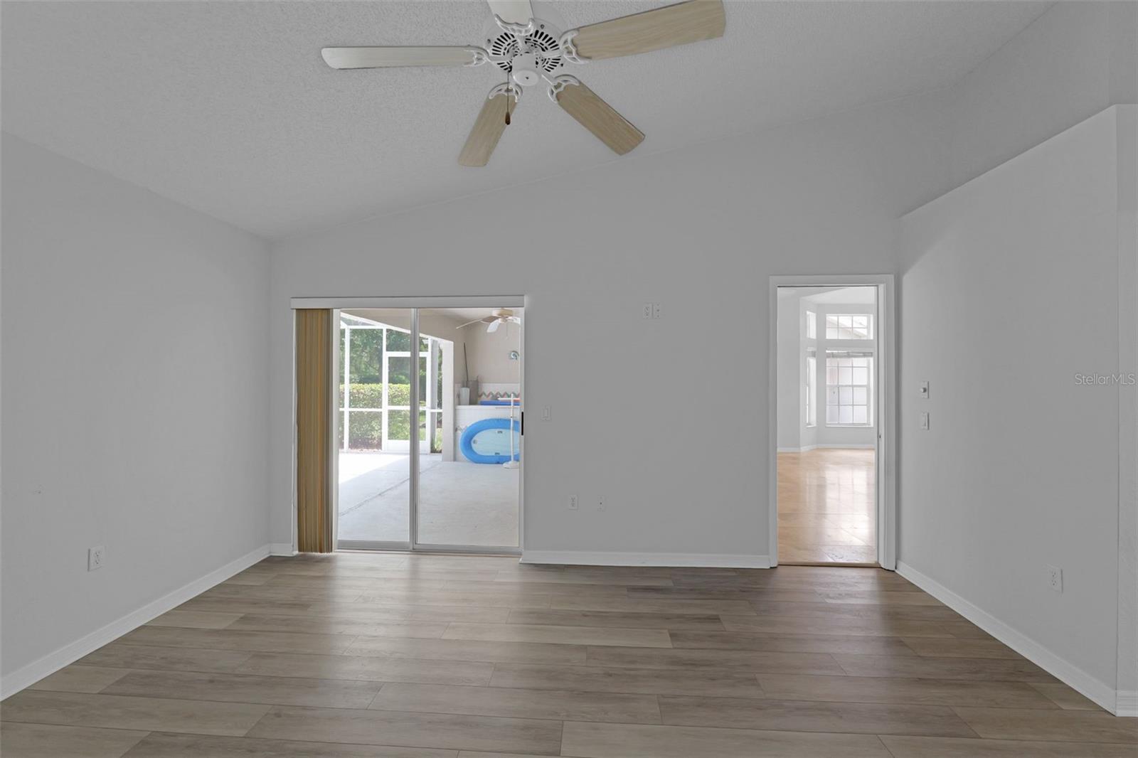 Main bedroom w/sliders to the pool