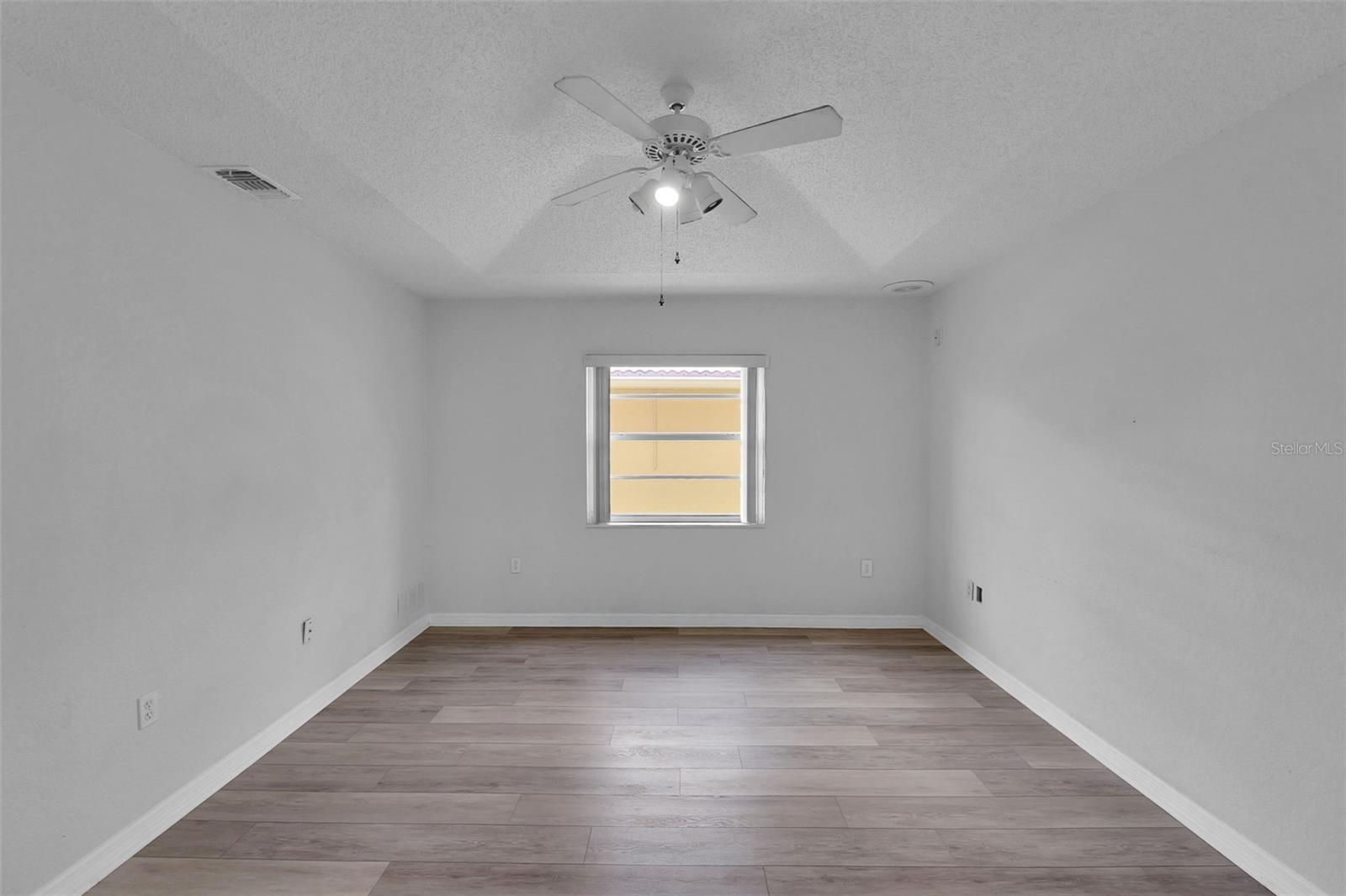 Bedroom 2 with window, door and closet
