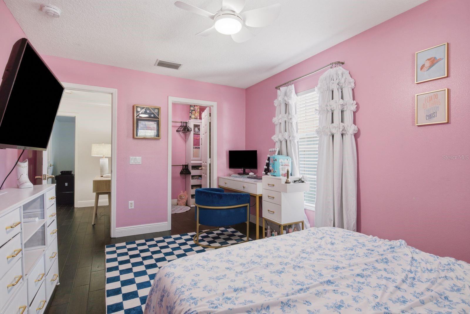 Custom closet system in Bedroom 3