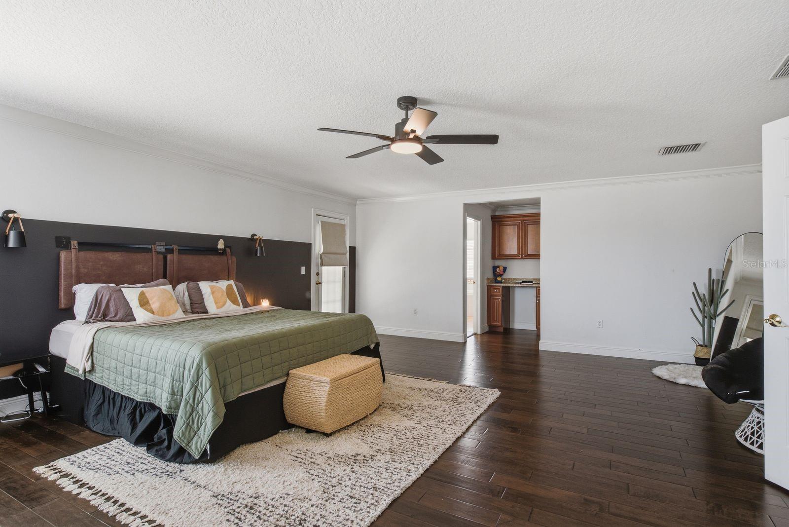 Very Large Primary Suite and oversized walk in closet with working desk area.