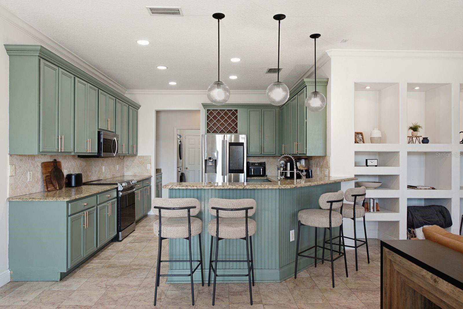 Kitchen with fluted wood detail on back of bar/counter