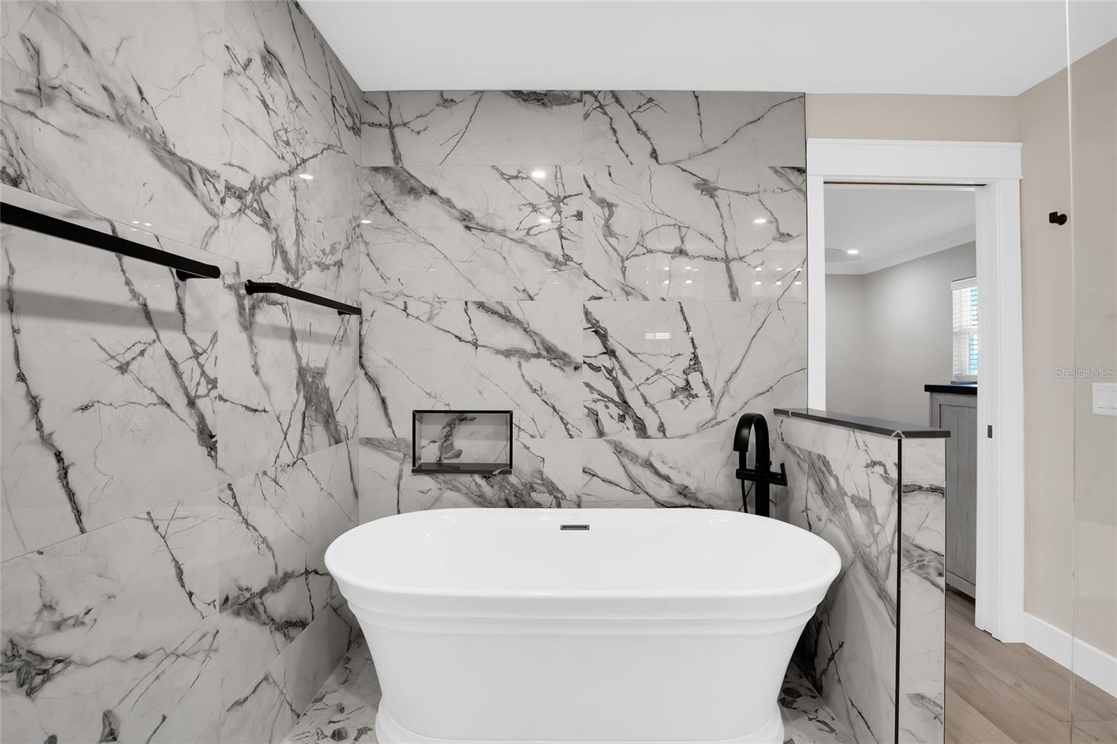 SHOWER AND TUB IN THE PRIMARY BATH