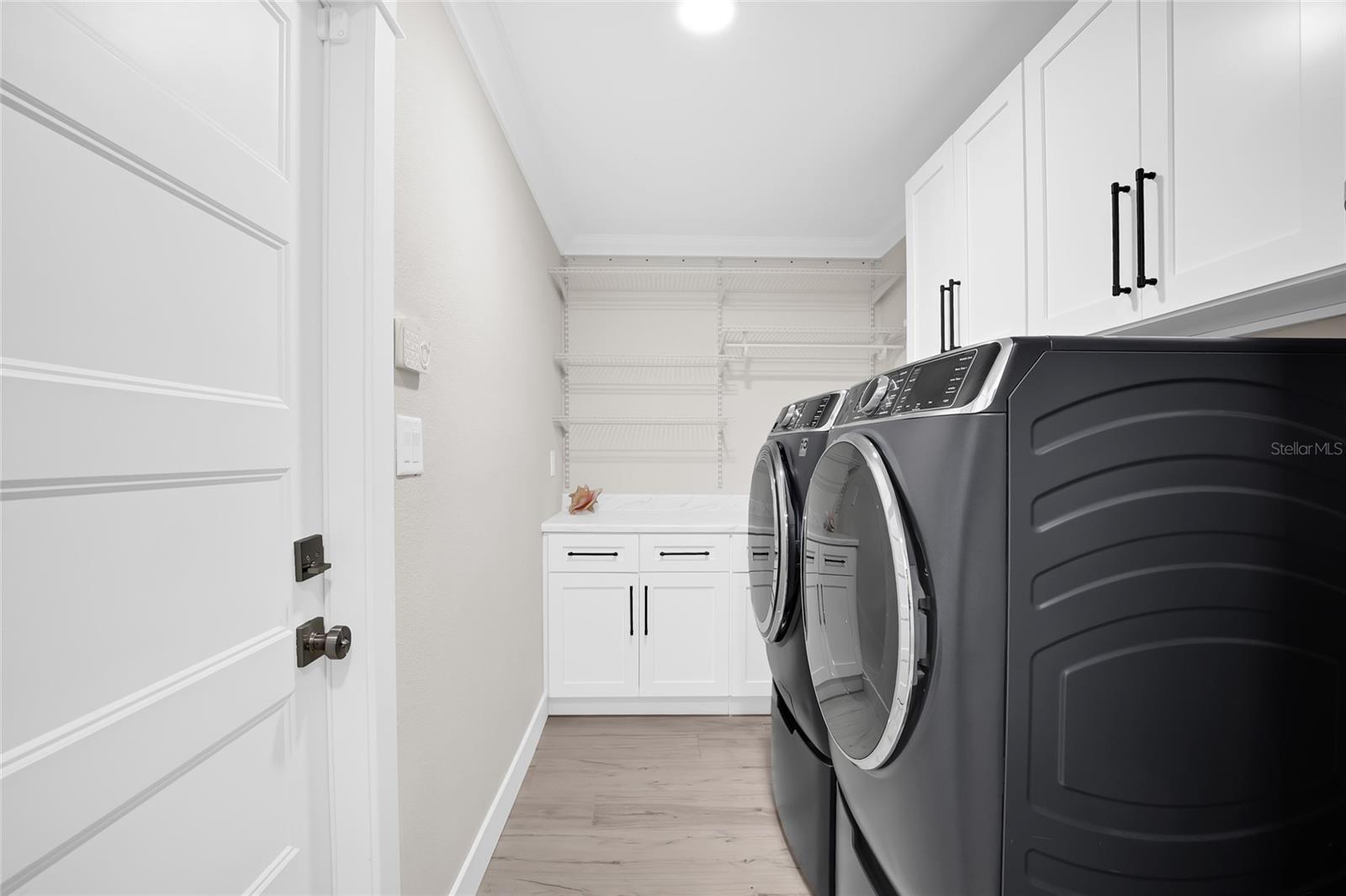 INSIDE LAUNDRY.  AMPLE STORAGE - WASHER AND DRYER ARE NEW AND CONVEY