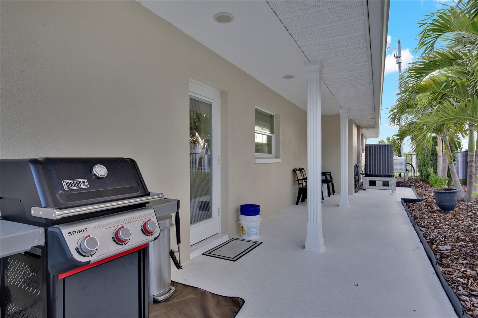GRILL SPACE + NEW HVAC WITH 10 Y WARRANTY.  DOOR LEADS TO KITCHEN - FULL FENCED YARD